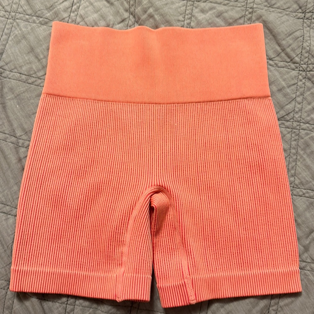peach colored gym shorts/spandex. small